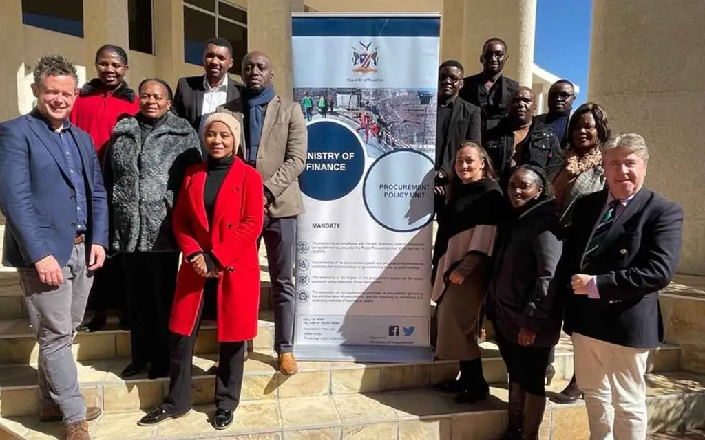 Gary Clifford, HelpUsTrade and Dermot Cahill, HelpUsTrade, flanking the Procurement Policy Unit (PPU), a unit within the Ministry of Finance, Namibia.